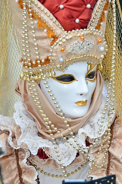 Beautiful carnival costume with gold pearls
