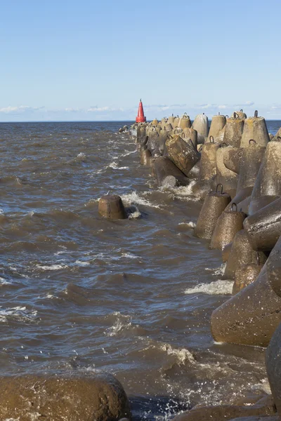 White Lake waves beat against the pier at the city of Belozersk in the Vologda region, Russia