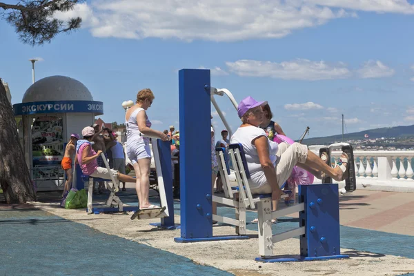 People engaged physical activity at street simulators on the promenade of the resort of Gelendzhik, Krasnodar region, Russia