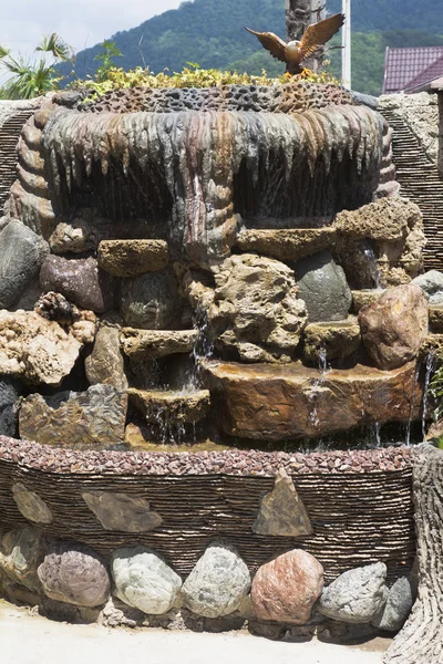 An artificial waterfall in courtyard of the house