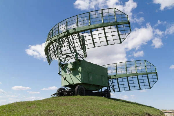 Military equipment radio radars in blue sky.