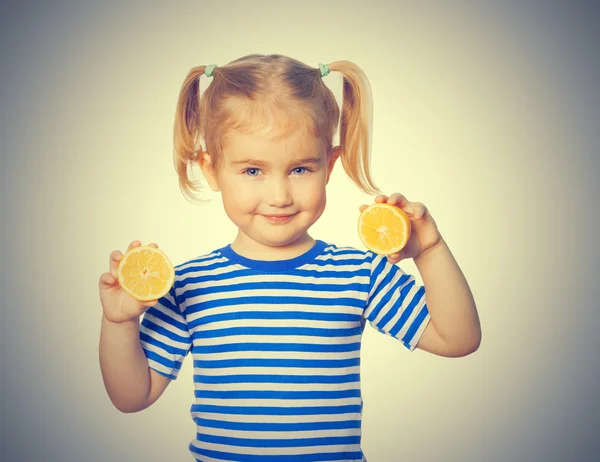 Little Funny girl keeps lemons