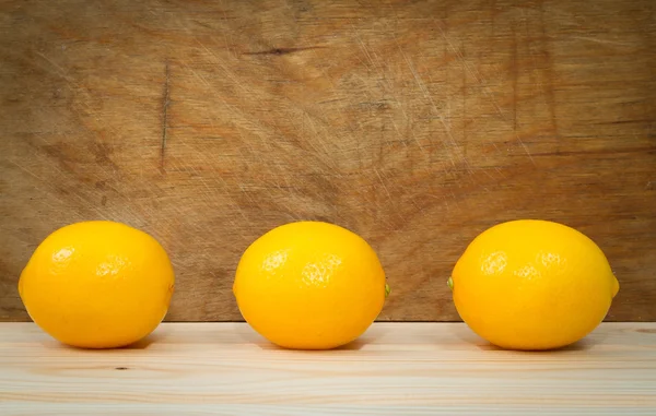 Bright yellow juicy lemons on  table.