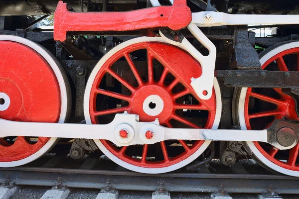 Three locomotive wheels close-up