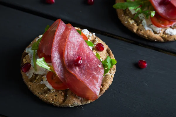 Crispbread with cream cheese and smoked beef, tasty snacks