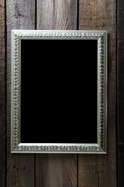 Vintage frames on wooden background with space for text