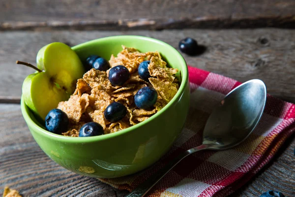 Healthy breakfast. Cereal with blueberries and apple