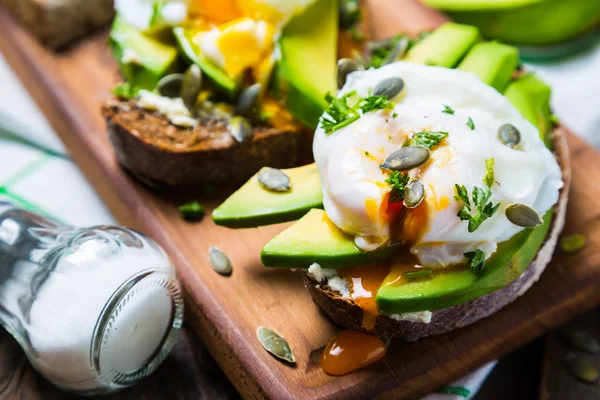 Sandwich with avocado and poached egg