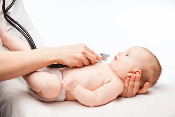 Doctor checking baby's heart beat