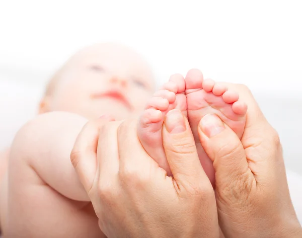 Baby girl receiving foot massage