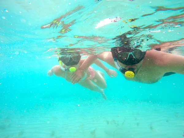 Couple snorkeling underwater