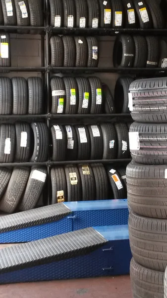 Car tyres on shelves