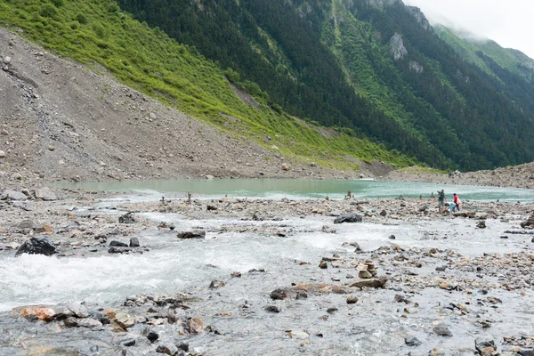 YUBENG, CHINA - Aug 9 2014: Ice Lake at Yubeng Village. a famous landscape in the Tibetan village of Deqin, Yunnan, China.