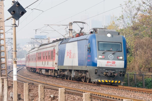 HENAN, CHINA - NOV 19 2014: China Railways HXD3 electric locomotive in Luoyang, Henan, China. The locomotive is designed for hauling 5000t freight trains.