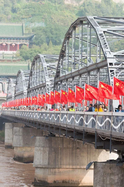 LANZHOU, CHINA - OCT 2 2014: Sun Yat-Sen Bridge (Zhongshan Qiao). a famous First Bridge across the Yellow River in Lanzhou, Gansu, China.