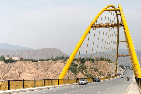 GUIDE, CHINA - Jun 27 2014: The yellow river big bridge(Huanghe Qing Daqiao). a famous landmark in the ancient city of Guide, Qinghai, China.