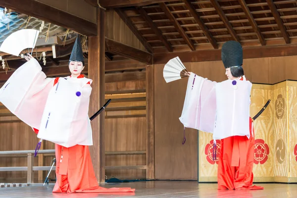 KYOTO, JAPAN - Jan 12 2015: Tradition folk Dance at a Yasaka-jinja Shrine. a famous shrine in the Ancient city of Kyoto, Japan.