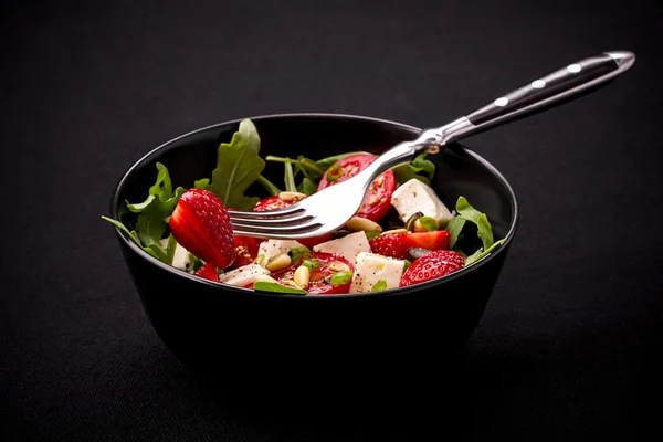 Strawberry tomato salad with feta cheese, olive oil