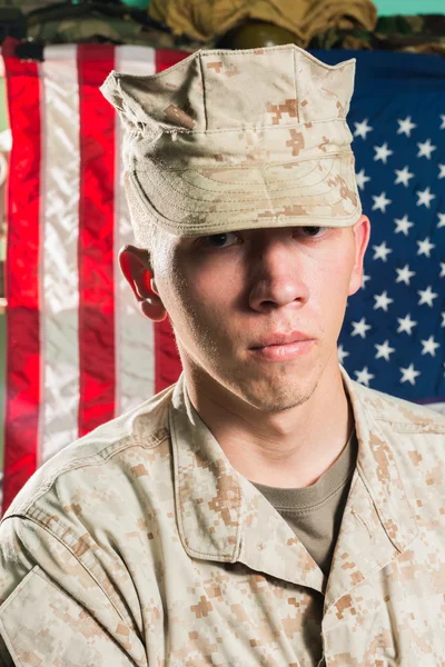 Man in military uniform on USA flag background