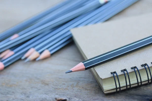 Black pencils and book