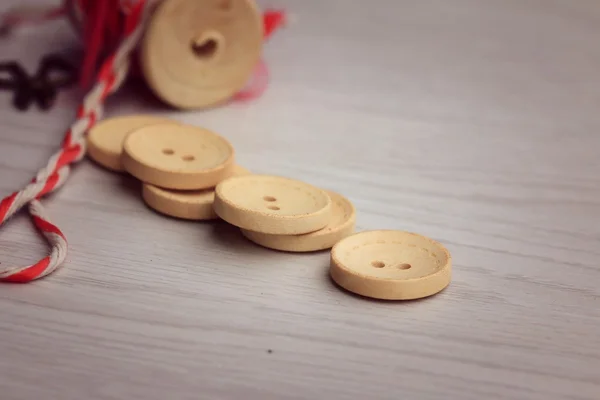 Vintage wooden bobbin thread and buttons.