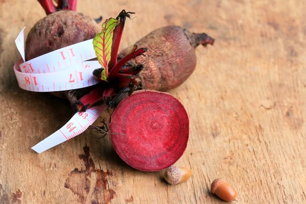 Fresh vegetables beetroot and tape measure