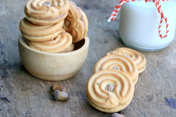 Tasty cream cookies and milk