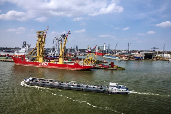 ROTTERDAM, NETHERLANDS - JUL 4, 2016: Cargo vessel in sea port Rotterdam, Netherlands.