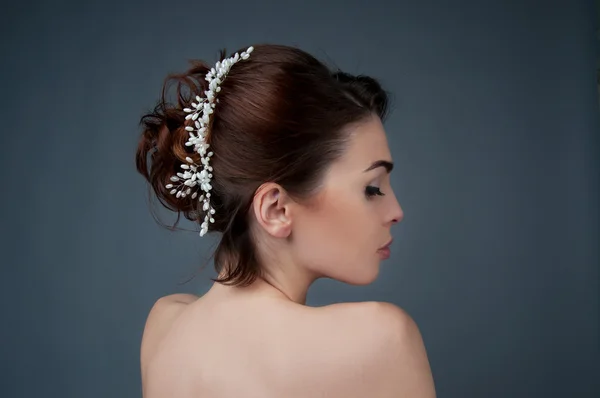 Bridal hairstyle. Brunette with curly hair and beaded headpiece.