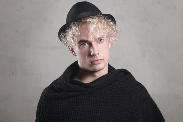 Young blond man in the studio, the northern type of man,