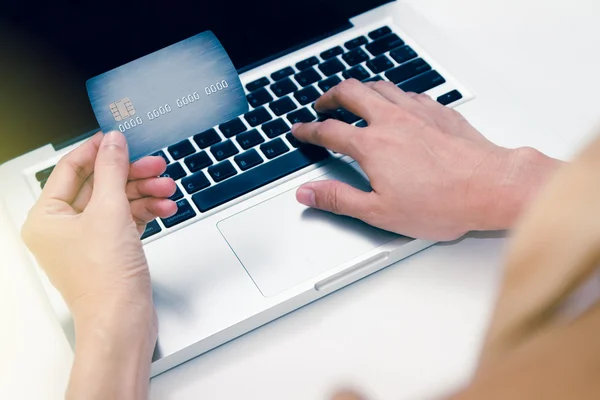 The online shopping card and holding credit card with hand for p