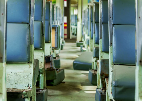 Interior of an empty antiqued train cabin in Thailand.
