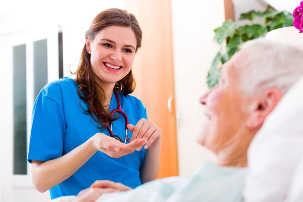 Nurse with elderly woman patience