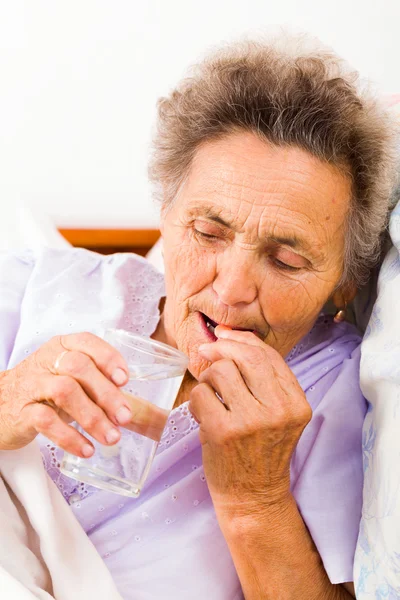 Elderly Woman with Pills