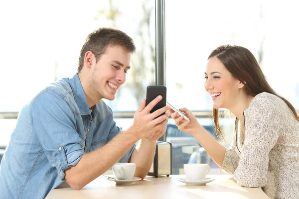 Couple sharing media content with smart phones