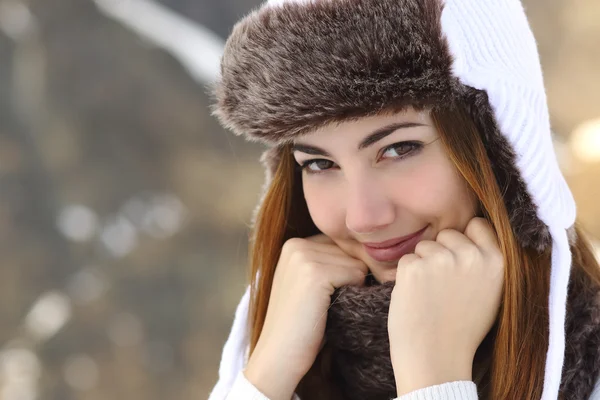 Beauty woman face portrait warmly clothed in winter
