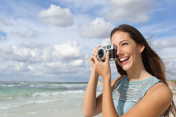 Tourist photographer girl taking photo in holidays