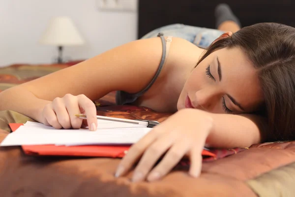 Student tired and sleeping in her room