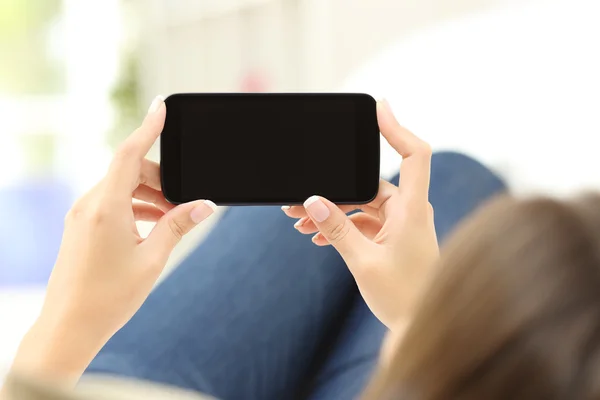 Woman watching media in a smart phone