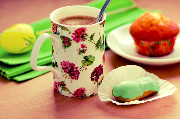 Coffee and green matcha tea eclair, cupcake, Easter egg