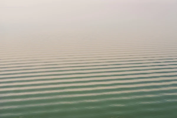 Calm open sea with ripple on water