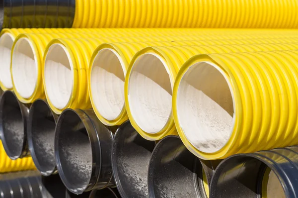 Stack of corrugated plastic pipes
