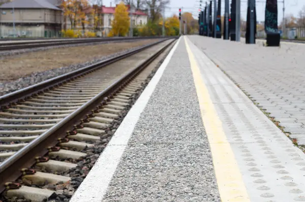 Blurred image of railway track and rail platform