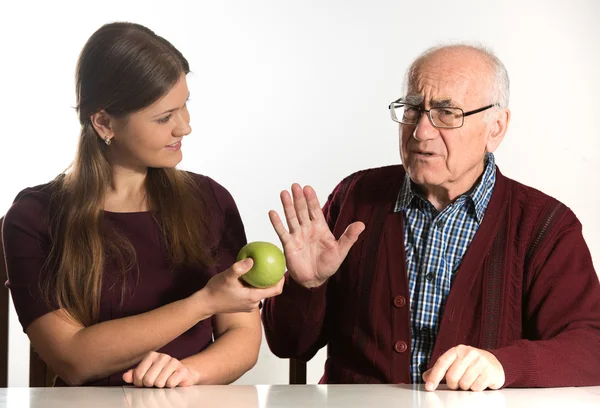 Young woman helps senior man