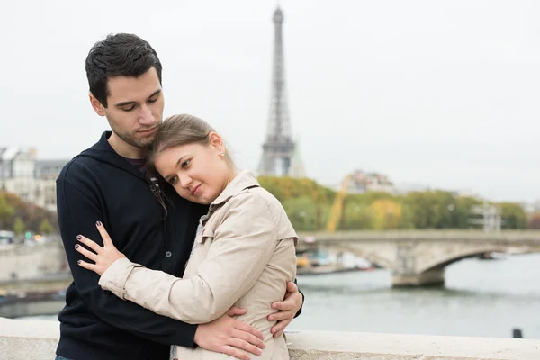 Young couple in Paris hugging
