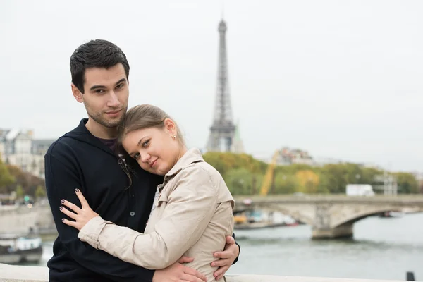 Young couple in Paris hugging