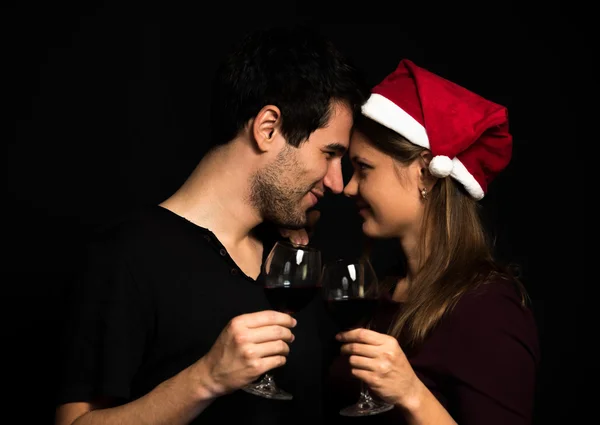 Young couple on black background