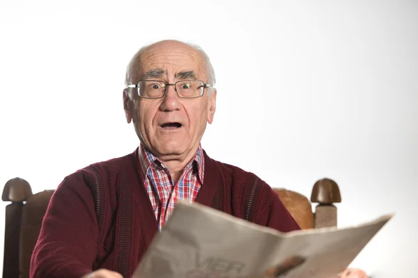 Old man reading newspapper