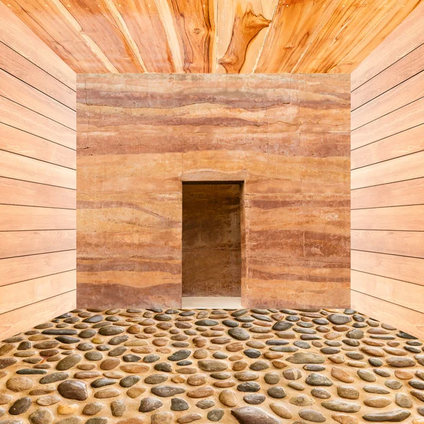 Stone wall with door and stone floor in wooden room