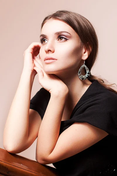 Portrait of elegant woman in a luxury simple dress on white background beautiful windows